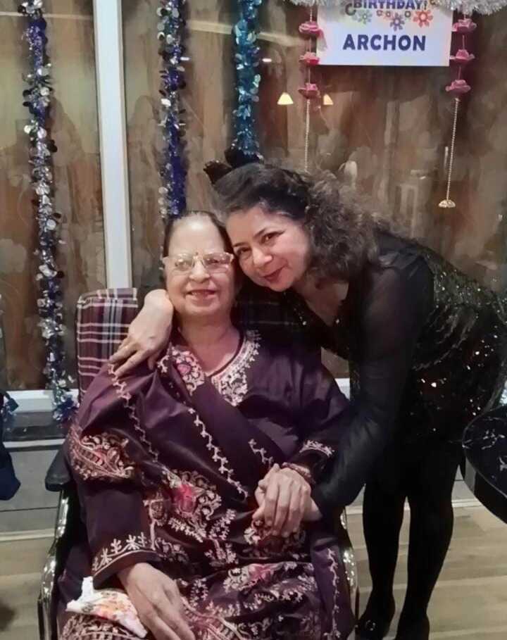 Dr. Rachna Kumar embracing a resident