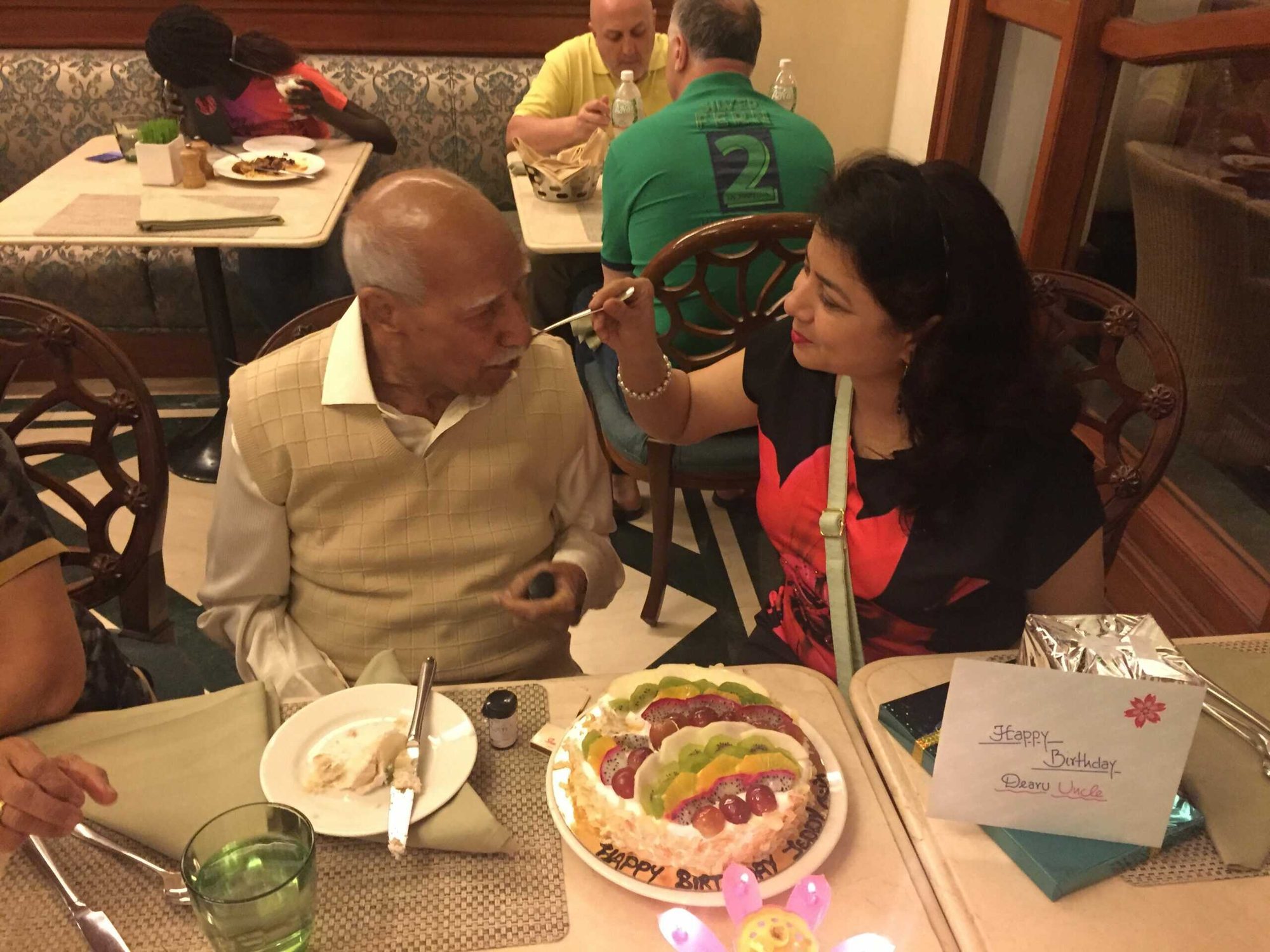 Dr. Rachna Kumar sharing a meal with a resident